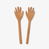 Hands Serving Spoons